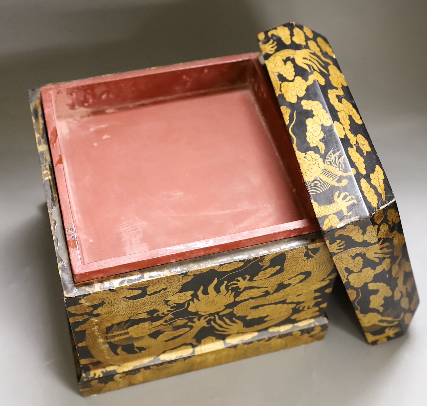 A Chinese black and gold lacquer ‘dragon’ box, early 20th century, 26.5 cms x 26.5 cms